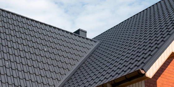 Gray metal roof with ridges and valleys