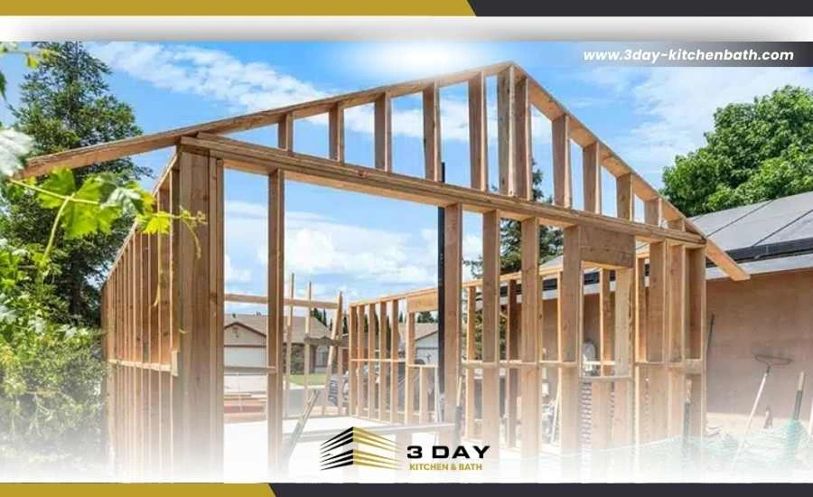 Stick-built ADU framing with lumber assembled directly on the property