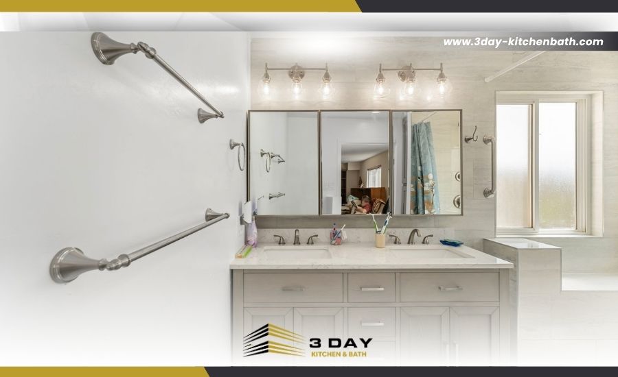 Front view of a newly installed double vanity with brushed nickel hardware and modern overhead lighting in a small bathroom remodel in San Diego, CA.