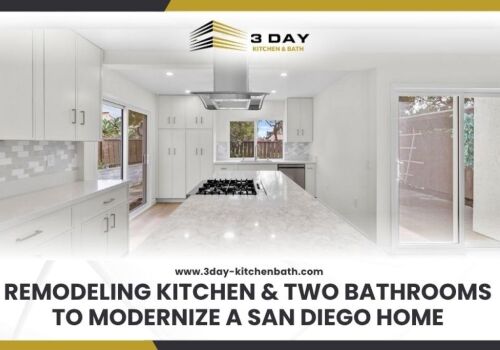 A bright spacious kitchen with a long marble patterned island white shaker cabinets a stainless steel range hood and sliding glass doors letting in natural light