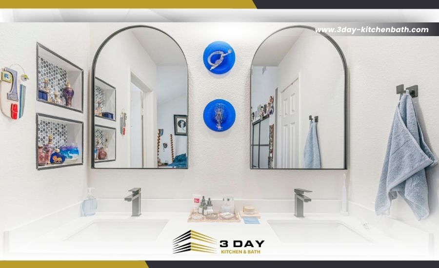 Modern double vanity bathroom renovation with arched mirrors and the 3 Day Kitchen & Bath logo.