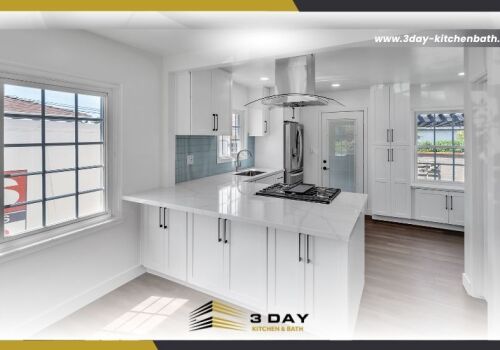 Modern, bright open-concept kitchen renovation with white cabinets, a central island cooktop, and the 3 Day Kitchen & Bath logo.